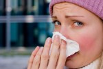 Woman sneezing