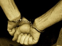 Teen Held After Teller Shot in Bank Robbery