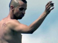 Man Clad in Nothing But Smile Dances on Billboard