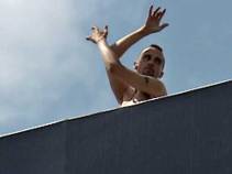 Traffic-Stopper: Naked Man Dances on Billboard