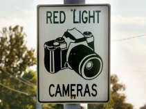 Cities Put Pedal to Metal Ahead of Red-Light Camera Ban