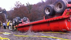 Water Tanker Overturns, Trapping Driver