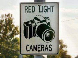 Cities Put Pedal to Metal Ahead of Red-Light Camera Ban