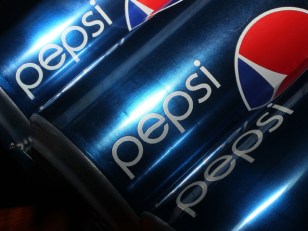 Store Owner Pelts Armed Robber With Soda Cans