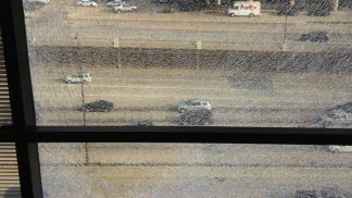 Dallas High Rise Hit by Bullets