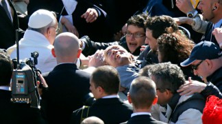 Pope Francis Blesses Man in Wheelchair 