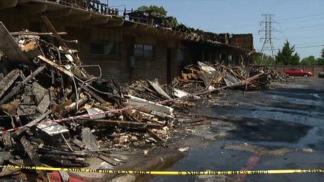 Residents Comb Through Apartments After Deadly Fire
