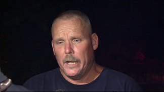 Crews Work to Rescue Worker From Tower