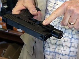 Plano Officer Says He Fired While Trying to Turn on Flashlight