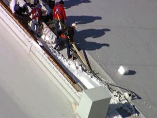Firefighters Chip Away at Ice on Cowboys Stadium Roof