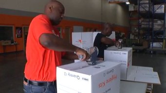 Relief Group Giving Care Packets to Tornado Victims