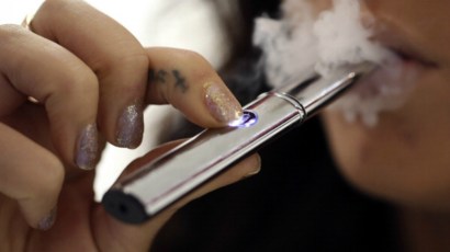 From a distance, e-cigs look just like the real thing.  But are they any safer?