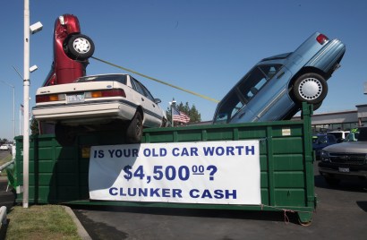 Used cars are seen in a dumpster to draw attention to the "Cash for Clunkers" program at Performance Chevrolet  in Sacramento, Calif., Saturday, Aug. 1, 2009.  On Friday Congress approved an additional $2 billion for the program that provides $3,500 or $4