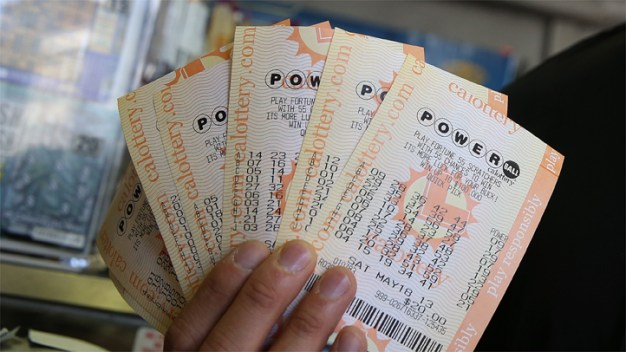 Last-Minute Fortune Seekers Buy Powerball Tickets