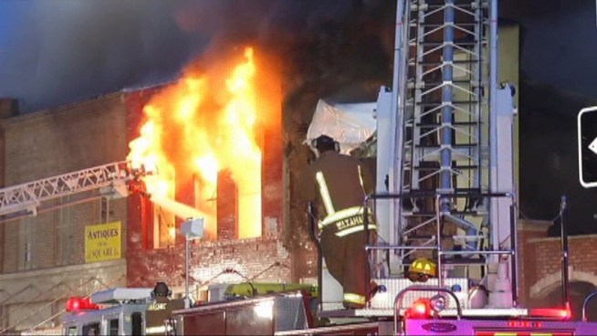 A massive fire destroyed a century-old restaurant and barber shop that were landmarks in the city of <a title=