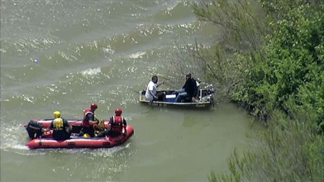 Dallas Fire-Rescue had to come to the aid of two men when the aluminum boat they were in flipped and filled with water.