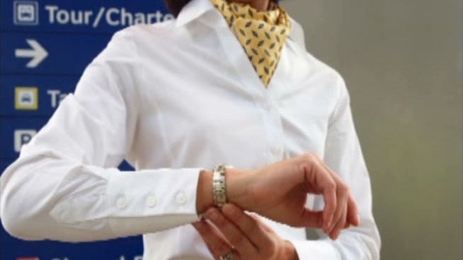 The union representing American Airlines flight attendants is asking its members not to participate in a company contest to find models for new uniform accessories.