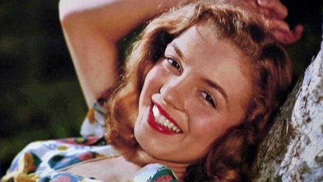 Rare photos of Marilyn Monroe before she was a blond bombshell are up for auction in Dallas.