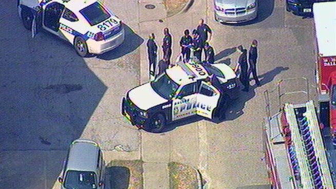 Dallas Police said a security guard died after he was shot by a suspected bank robber near the Bank of America in the 3500 block of South Lancaster on Wednesday.