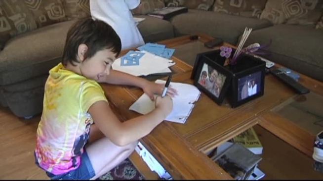 Denton County is recognizing a 7-year-old girl who called 911 when her mother began having chest pains while driving.