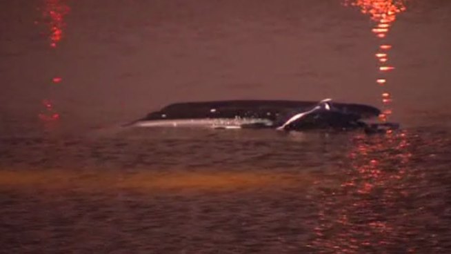 Dallas Police officers and citizens were recognized after they helped rescue a man from his car as it went underwater in Bachman Lake Friday morning.