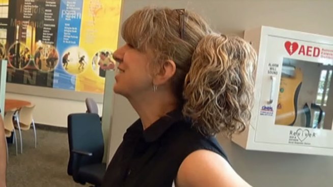 After collapsing from a heart attack during a racquet ball match at an Arlington fitness club, Nancy Miller met with the quick-acting strangers who saved her.