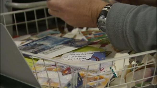 Community members in Carrollton recycle their Christmas cards.