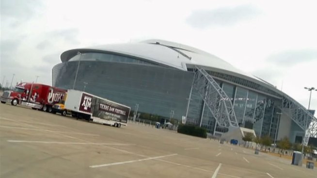 Die-hard Oklahoma Sooner and Texas A&M Aggie fans have started tailgating outside Cowboys Stadium in Arlington before the Cotton Bowl on Friday.