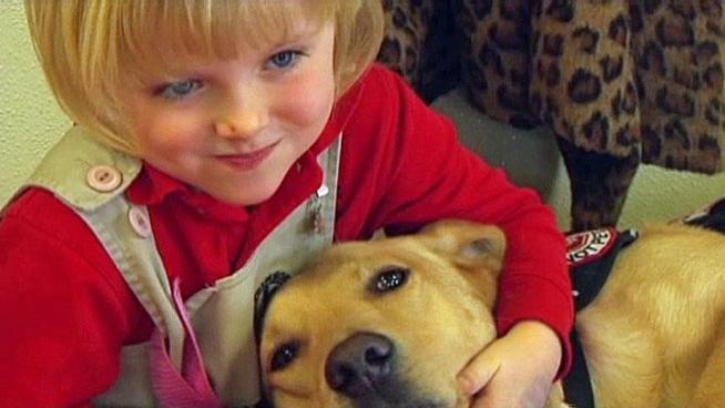 Five-year-old Lily Simonton's diabetic alert dog Charlie gives her mother and teachers peace of mind and she says he saves her life.