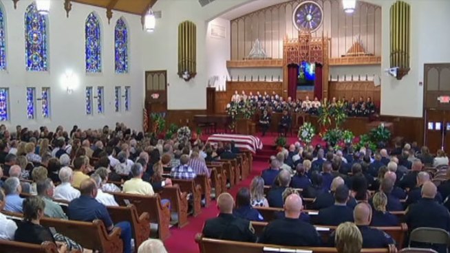 Lancaster police officer Dustin Dodson was laid to rest in Cleburne Thursday. Police said Dodson was killed by a suspected drunk driver over the weekend.