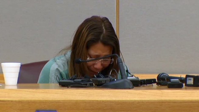 The Dallas woman who pleaded guilty to gluing her toddler's hands to a wall cried when a photo of her daughter's injuries were shown in court.