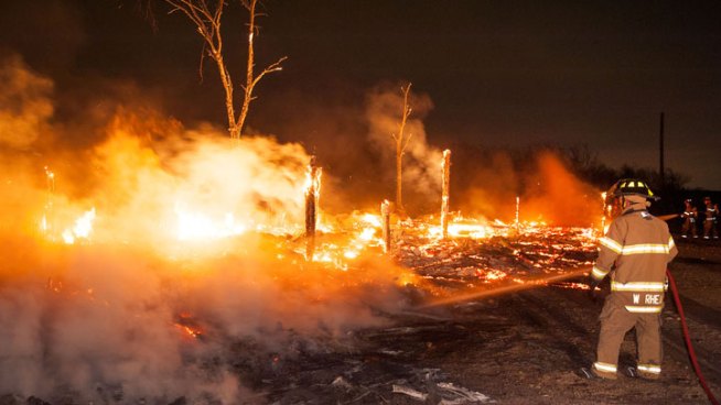 Fort Worth firefighters extinguish flames save some horses from burning stables.