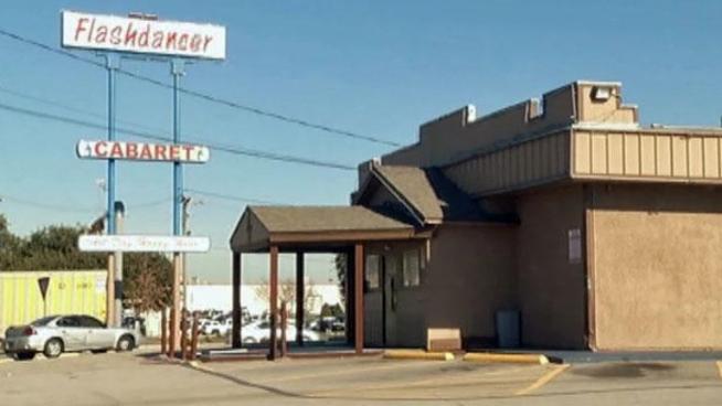 An owner of an Arlington strip club was charged Tuesday with trying to hire a hit man to kill Arlington Mayor Robert Cluck and a city attorney involved in an ongoing legal fight with the bar.