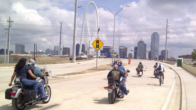 The first vehicles, motorcycles and a Vespa, rolled eastbound toward downtown Dallas at around 1 o'clock Thursday afternoon. The bridge will open in stages.