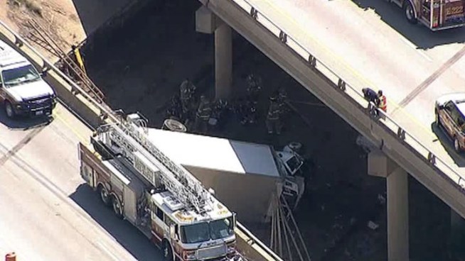 Aerial view from Chopper 5 shows a truck that crashed into Fossil Creek, injuring the driver and closing Loop 820 at US 377/Denton Highway.
