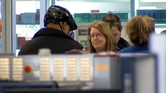 The attorney of a 65-year-old woman who boarded an American Airlines flight with a handgun says his client forgot the gun was in her bag.