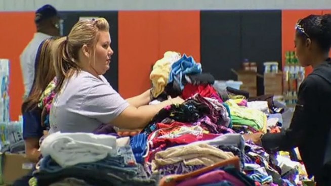 A team of government inspectors, an army of insurance adjusters and volunteers have descended on Lancaster to help residents recover from tornado destruction.