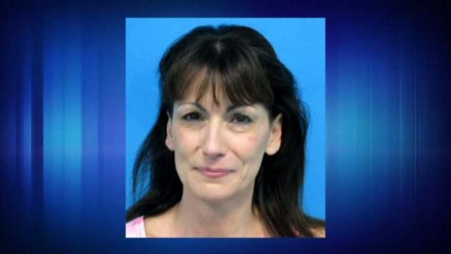A woman has been charged with murder in the death of her husband, who she originally said was killed in a home invasion, in Keller.