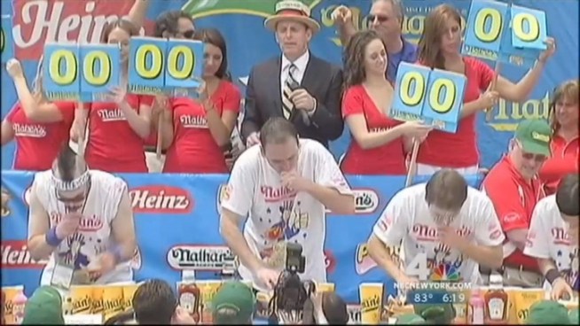 Reigning champ Joey Chestnut scarfed down 62 wieners in 10 minutes to win his fifth consecutive July Fourth hot dog eating contest at New York's Coney Island.