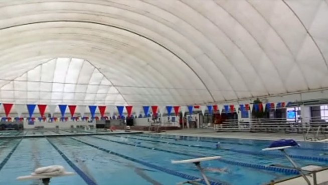 For the first time the indoor/outdoor pool at the North Lake Aquatic Center in Irving is keeping its roof on during the summer months. It's a move that's saving the facility a lot of money.