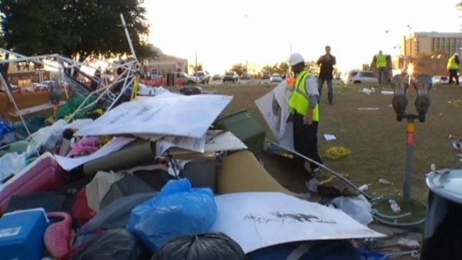 The day after Dallas police evicted Occupy Dallas from City Hall Park, city workers cleaned the park, the city explained its decision to close down the camp and the group started regrouping.