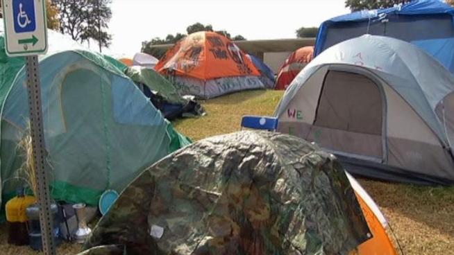 A federal judge says the city can evict Occupy Dallas' campsite, but the mayor says Dallas will not take any action until after both sides meet Wednesday.