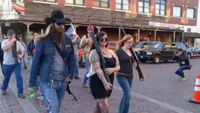 More than a dozen people marched through the Fort Worth Stockyards armed with rifles and shotguns, they say they're ready to fight for the right to openly carry their weapons in public.