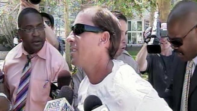 A man lunged at Paris Hilton's boyfriend, Cy Waits, as the two were about to attend the trial of Hilton's alleged stalker, Nathan Lee Parada.