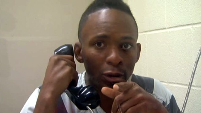 Robert Wallace, 39, one of two people charged in the armed robbery of a MetroPCS store in Dallas, says he wants to apologize to a 4-year-old who was held at gunpoint. Surveillance video shows a man that police say was Wallace's accomplice pointing a gun at the girl during the holdup.