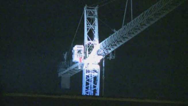 WARNING VIDEO MAY BE DISTURBING: Video shows man who had been in a standoff with Dallas police inside a crane on the campus of Southern Methodist University climbs out and falls to his death just before 2 a.m. Tuesday.