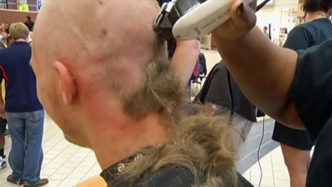 One buzz cut at a time, McKinney Boyd High School went bald in memory of Juan Rodriguez, a fellow student who lost his battle with cancer. The money raised Friday will support the schools relay for life team.