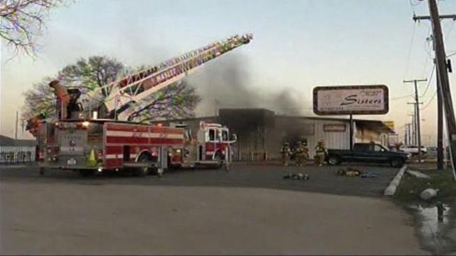 The search continues for the man police say splashed a woman with gas then torched Sisters Antique Mall in Saginaw Tuesday afternoon.