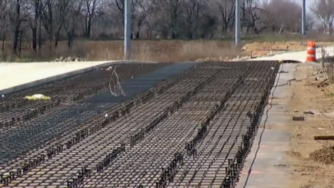 The Texas Department of Transportation says construction on  State Highway 114 in front of Texas Motor Speedway is on time for an Oct. 2014 completion despite delays.