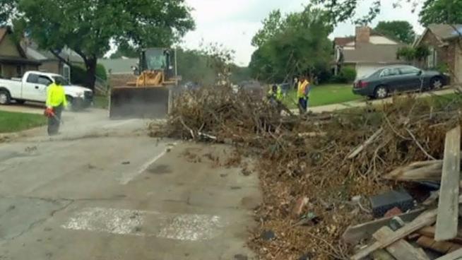 The Arlington Public Works Department deployed crews on a massive cleanup effort to pick up debris and clear streets in the tornado damage zone so residents can start to get back to normal.